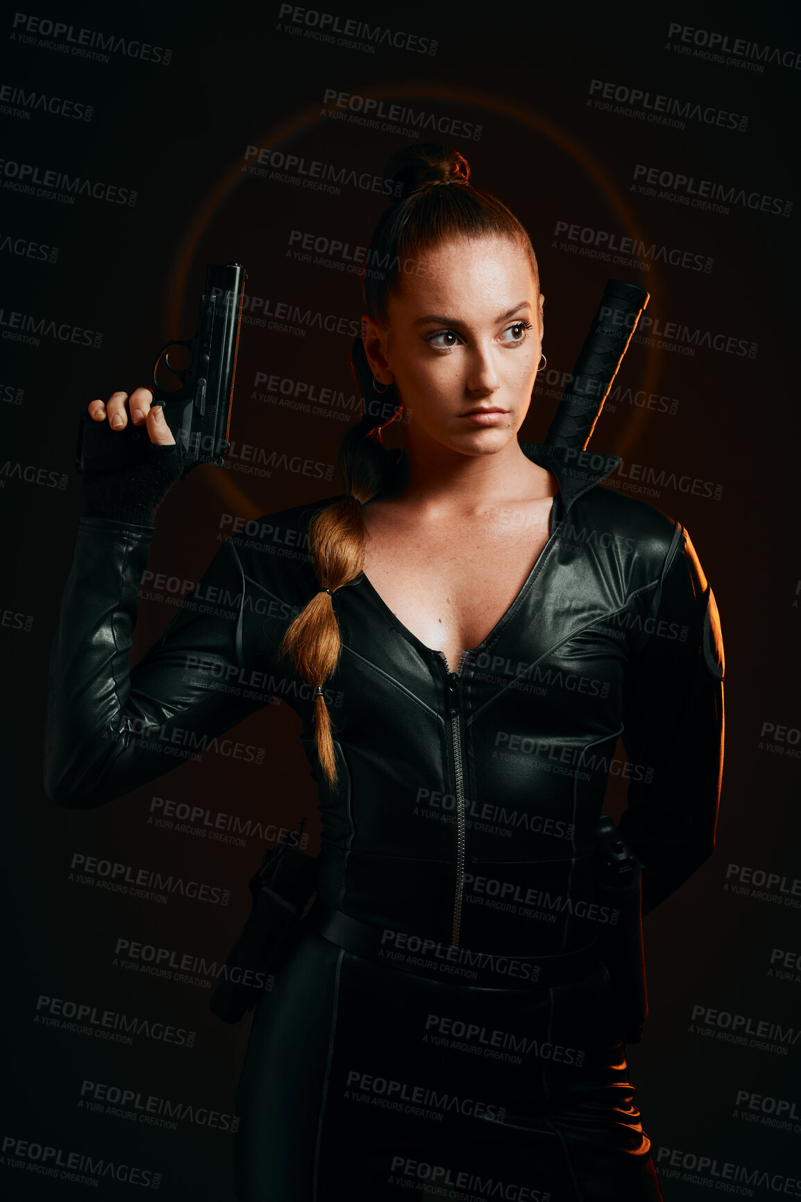 Buy stock photo Serious woman, warrior and gun in studio for action, fight and safety from danger on dark background. Strong female assassin or agent in scifi leather cosplay costume with weapon to fight or guard