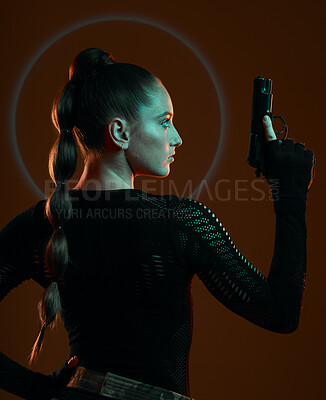 Buy stock photo Dark, assassin and a woman with a gun for action isolated on a studio background. Mission, warrior and a mafia agent with a weapon for protection, security and combat on a backdrop for a fight