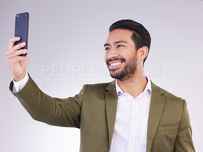 Buy stock photo Businessman, face and selfie with smile for profile picture, vlog or social media against a white studio background. Happy isolated employee man smiling on smartphone for photo, memory or online post