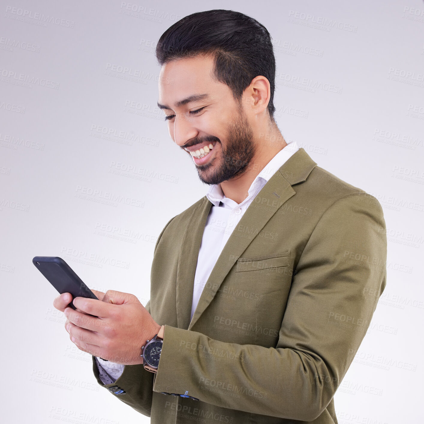 Buy stock photo Business man, smile and phone for communication in studio while typing and networking on gray background. Asian male entrepreneur with smartphone for email, online chat or marketing on social media