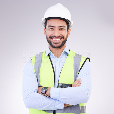 Buy stock photo Construction worker in portrait, man with crossed arms and smile, architect or engineer in building industry on studio background. Happy male contractor, mockup and professional builder with helmet