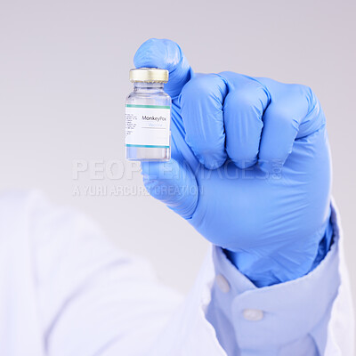 Buy stock photo Vaccine, doctor hands and monkeypox bottle for safety, medicine and healthcare innovation in studio. Closeup vaccination, person and liquid vial for drugs, medical virus and pharmaceutical research