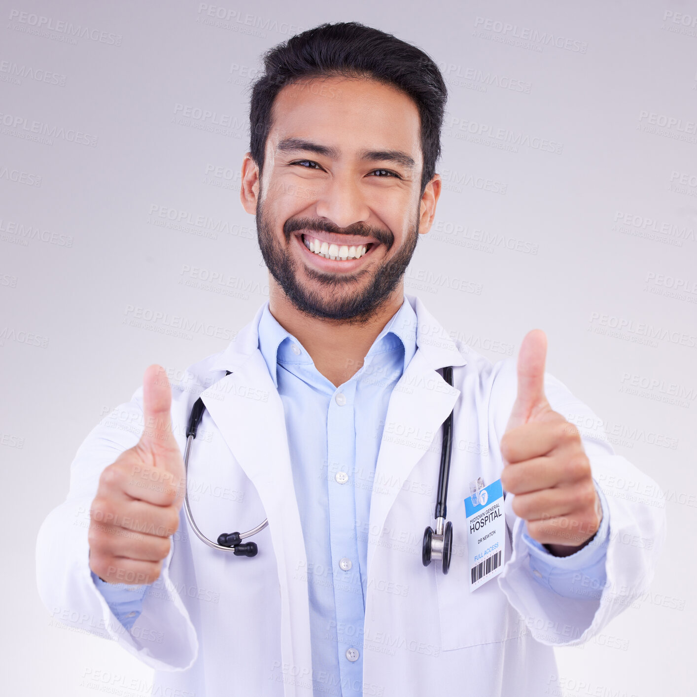 Buy stock photo Thumbs up portrait of man doctor isolated on a white background in healthcare success, thank you and service support. Like, yes and ok hands sign with face of medical worker or asian person in studio