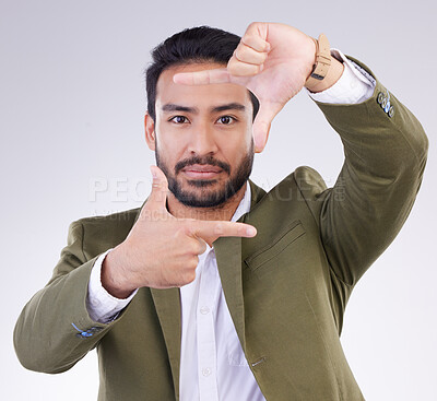 Buy stock photo Finger framing, portrait and business man in studio, background or capture profile picture. Face of male model, hands and frame perspective for selfie, photography ideas or imagine border of planning