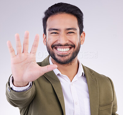 Buy stock photo Portrait, smile and Asian man with stop, hand and communication against grey studio background. Face Japanese male or guy with gesture for warning, sign language and welcome with opportunity or smile