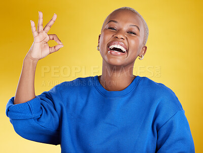 Buy stock photo Portrait, laughing and black woman with ok sign in studio isolated on a yellow background. Success, emoji face and happy, comic and funny female with hand gesture for okay, support or perfection.