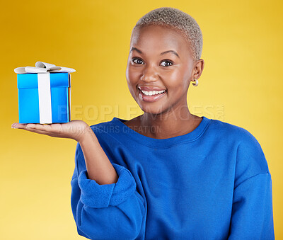 Buy stock photo Smile, portrait and black woman with gift in studio isolated on a yellow background. Face, box and happy African female with present for celebration, party and holiday, birthday and special event.