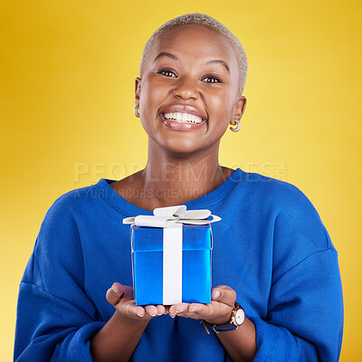 Portrait, smile and black woman with birthday gift in studio isolated on a yellow background. Face, box and happy African female with present for celebration, party and holiday for special event.