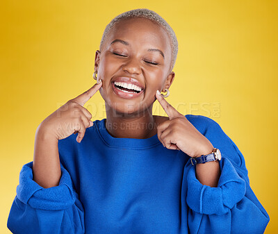 Buy stock photo Fashion, smile and black woman happy pointing at her face excited and confident isolated in a studio yellow background. Style, happiness and young female with a positive mindset and confidence