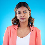 Face, portrait and business woman in studio isolated on a blue background with pride for career, profession or job. Boss, professional and confident, serious and proud female entrepreneur from India.