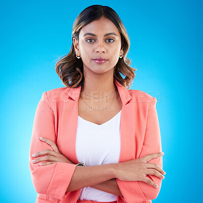 Buy stock photo Serious, portrait and business woman with arms crossed in studio isolated on blue background with pride for career. Face, professional and confident, assertive or proud female entrepreneur from India
