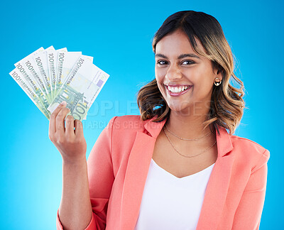 Buy stock photo Portrait, smile and business woman with euros in studio isolated on a blue background. Financial winner, face and happy Indian female with cash money after winning lottery, prize and competition.