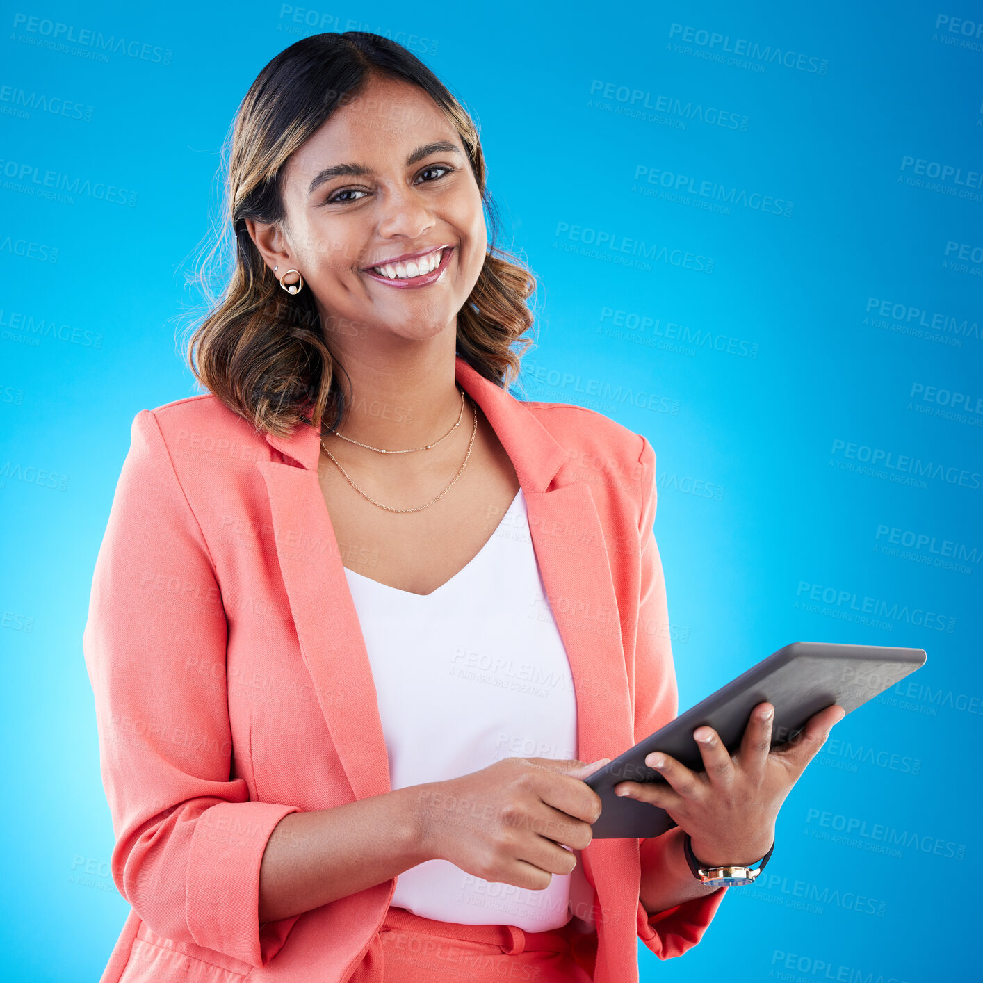 Buy stock photo Tablet, smile and portrait of business woman in studio isolated on a blue background. Technology, professional and happy, proud and confident female from India with touch screen for internet browsing