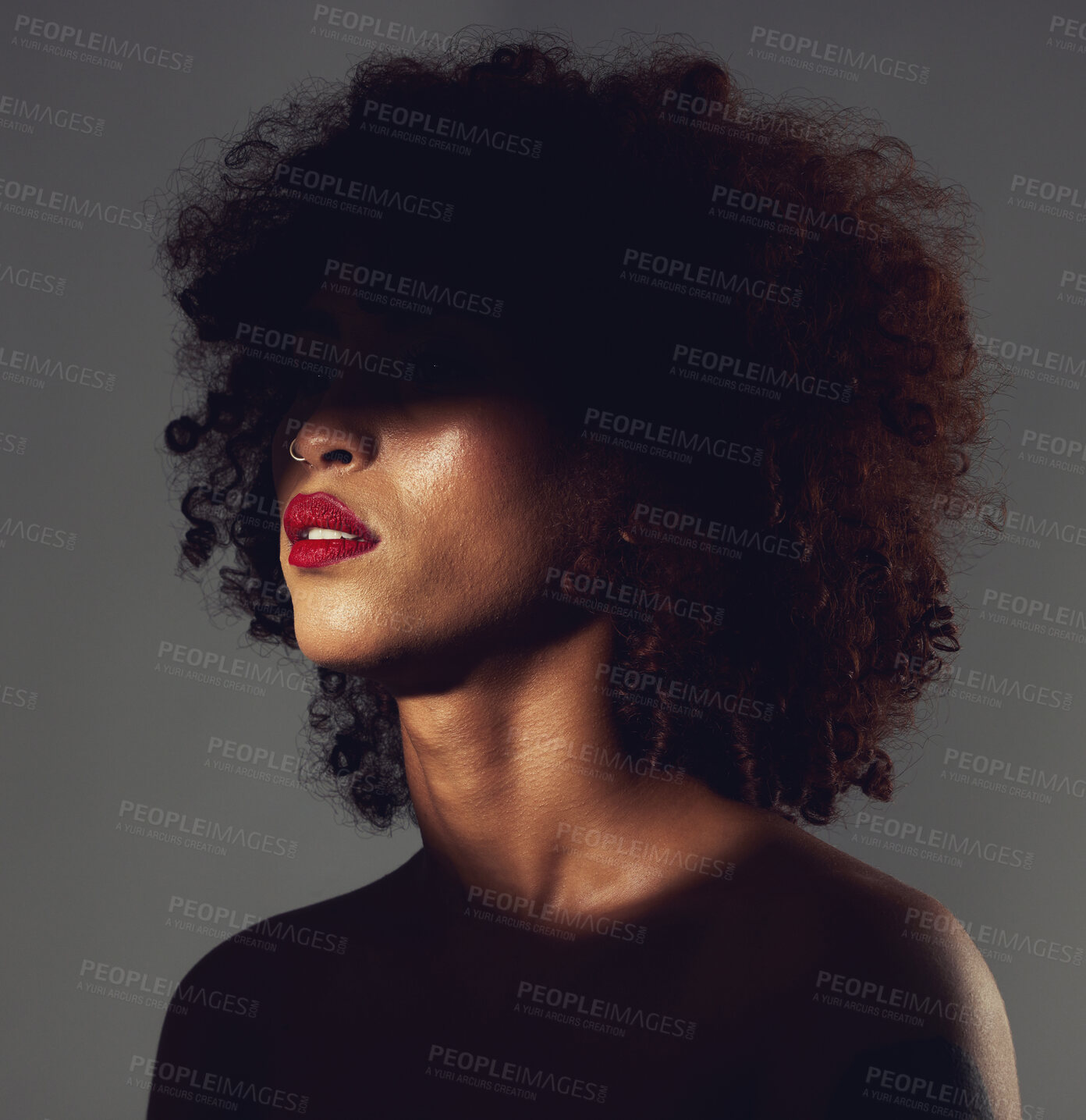 Buy stock photo Beauty, shadow and black woman haircare and makeup as skincare, cosmetic and self care in the dark or night. Spotlight, creative and face of female model with mystery aesthetic and luxury fashion 
