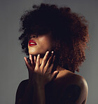 Black woman, red lipstick and shadow with beauty and makeup, hands with spotlight on studio background. Cosmetics, creative and aesthetic with beautiful female, cosmetology and art deco with manicure