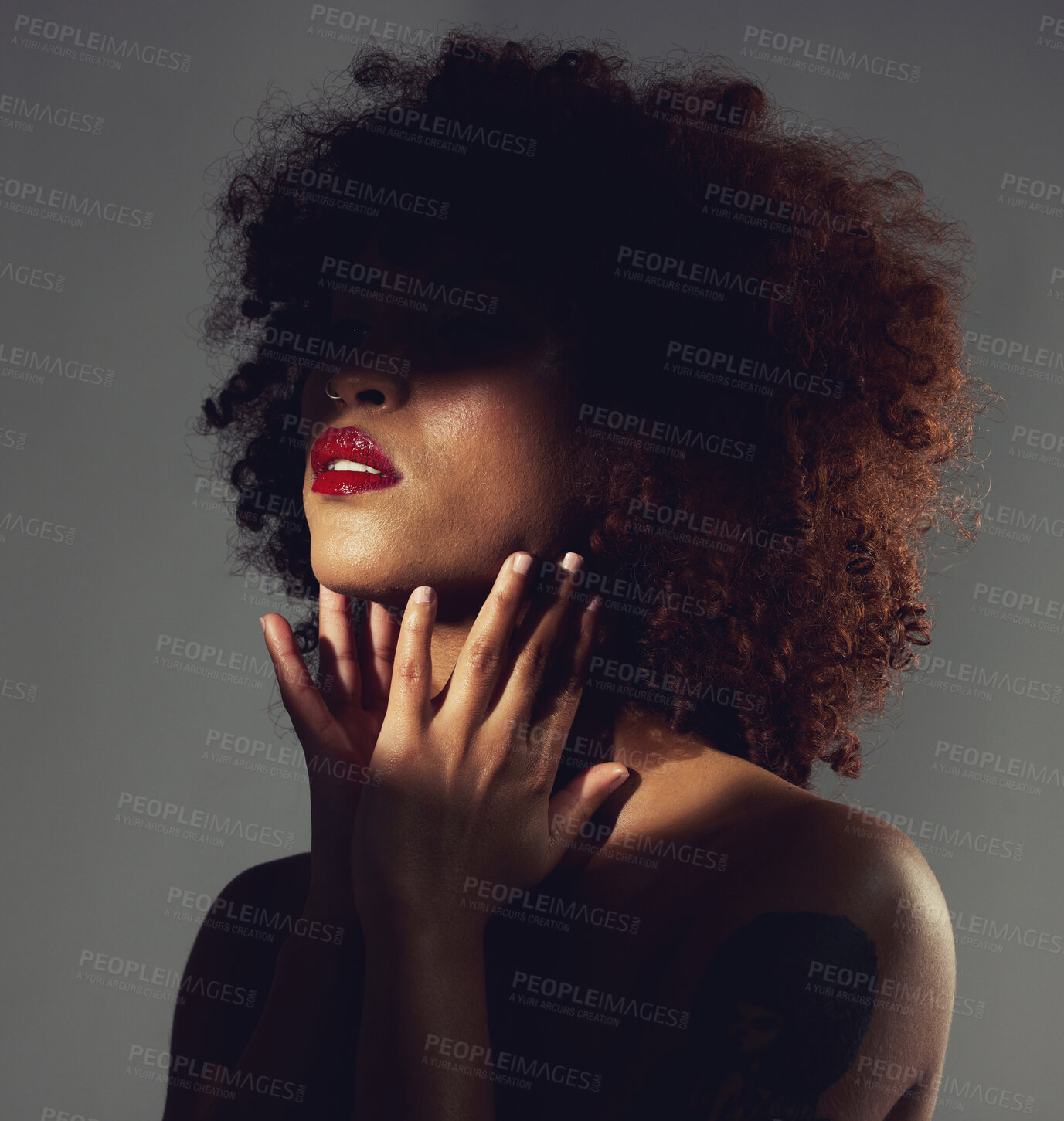 Buy stock photo Black woman, red lipstick and shadow with beauty and makeup, hands with spotlight on studio background. Cosmetics, creative and aesthetic with beautiful female, cosmetology and art deco with manicure