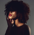Makeup, red lipstick and shadow of black woman with beauty, afro or natural hair in studio. Face of aesthetic female model with a skin glow, shine and color on lips for art, power and facial skincare