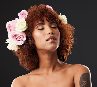 Buy stock photo Artistic, creative and woman with flowers in hair isolated on a black background in a studio. Calm, peaceful and a beautiful girl with self love, floral look and creativity on a dark backdrop