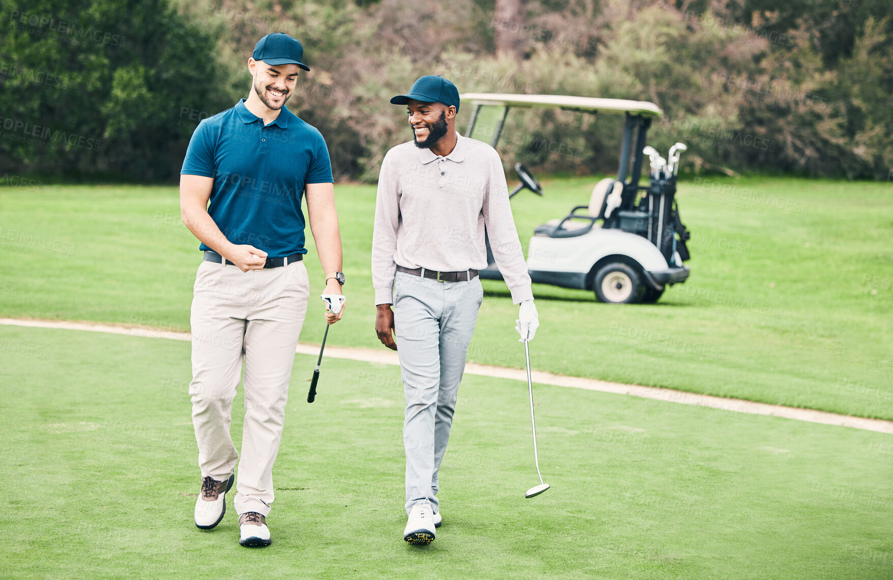 Buy stock photo Friends, sports and men on golf course walking, talking and smiling on green grass at game. Health, fitness and friendship, black man and happy golfer with smile, a walk in nature on weekend together