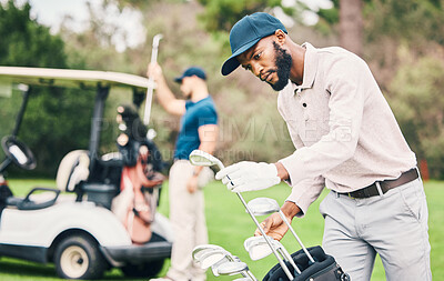 Golf, sports and black man on course with golfing bag of clubs ready to start game, practice and training on lawn. Professional golfer, activity and male caddy for exercise, fitness and recreation