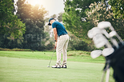 Buy stock photo Man, golf ball and putter on grass to ready for game, sport and aim shot in competition with focus outdoor. Professional golfer, start and put shooting for contest on field, lawn and course in summer