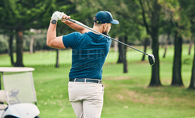 Golf, training and hobby with a sports man swinging a club on a field or course for recreation and fun. Golfing, grass and stroke with a male golfer playing a game on a course during summer