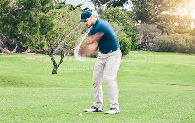 Golf, stroke and motion blur with a sports man swinging a club on a field or course for recreation and fun. Golfing, grass and training with a male golfer playing a game on a course during summer