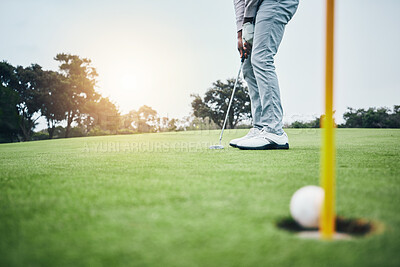 Ground, golf hole and man with golfing club on course for game, practice and training for competition. Professional golfer, sports and male athlete hit ball with club for winning, score or tee stroke