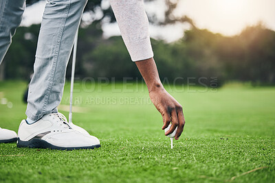 Buy stock photo Hobby, golf ball and tee with hand of black man on field for training, tournament and challenge. Start, competition match and ready with athlete and club on course for action, games and sports