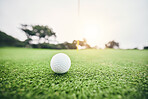 Sports, golf ball and target on course in club for competition match, tournament and training. Pitch, challenge and games with equipment on grass field for practice, recreation hobby and practice