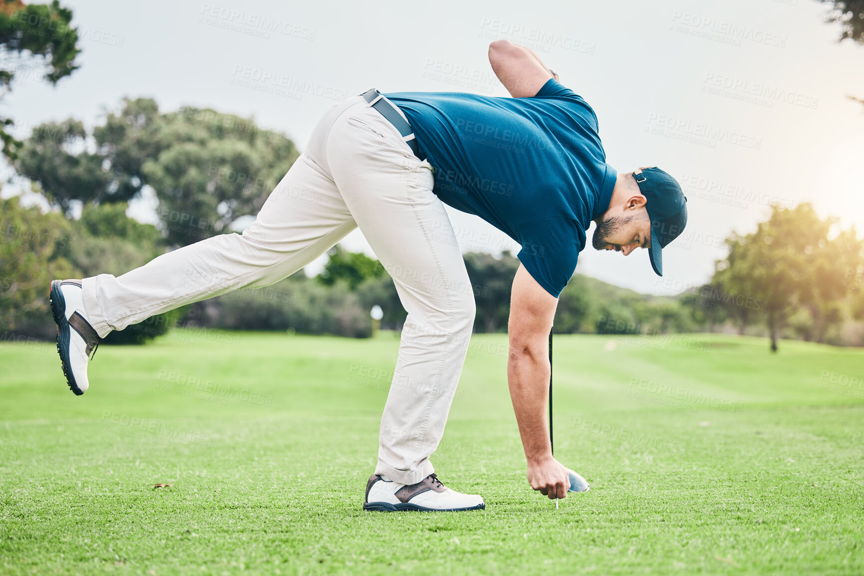 Buy stock photo Man, golf ball and tee on grass to ready for game, sport or international competition with focus outdoor. Professional golfer, start and preparation for contest on field, lawn and course in summer