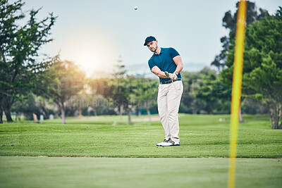 Golf, stroke and aim with a sports man swinging a club on a field or course for recreation, fun and hobby. Golfing, grass and training with a male golfer playing a game on a course during summer