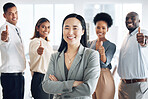 Asian woman, leadership and arms crossed, team and thumbs up, lead and professional mindset with collaboration. Diversity, teamwork and agreement, corporate group in workplace and smile in portrait