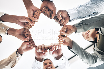 Buy stock photo Team building, circle or business people hands in fist for motivation in office meeting together. Diversity, low angle or happy employees with mission, strategy or group support for  project planning