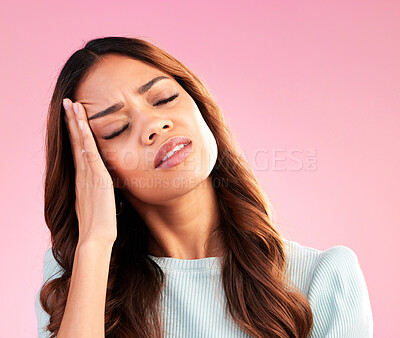 Buy stock photo Stress, anxiety and woman with headache in studio, tired and exhausted isolated on pink background. Mental health, burnout and depressed hispanic model with hand on head for pain and temple massage.