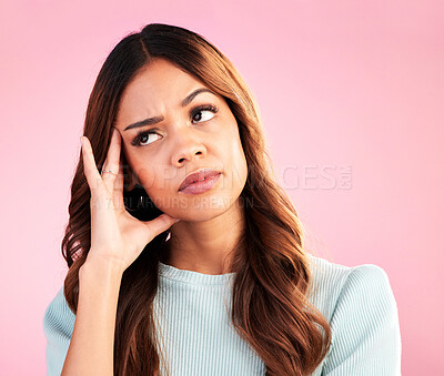 Buy stock photo Thinking, burnout and annoyed woman in studio, tired and exhausted isolated on pink background. Mental health, doubt and irritated hispanic model, hand on head in confusion with problem or brain fog.