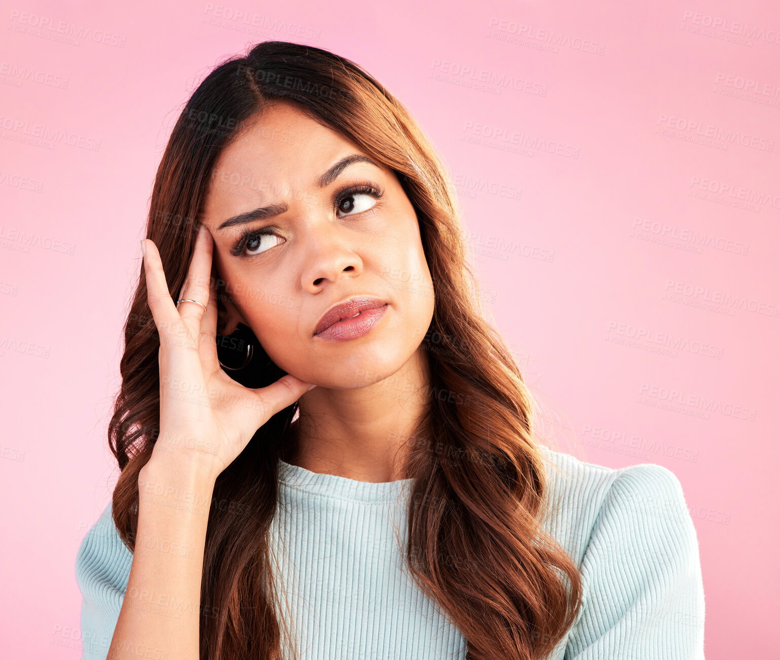 Buy stock photo Thinking, burnout and annoyed woman in studio, tired and exhausted isolated on pink background. Mental health, doubt and irritated hispanic model, hand on head in confusion with problem or brain fog.