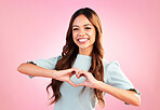 Love, heart hands and portrait of woman in studio for romance, positive and kindness. Peace, support and emoji with female and shape isolated on pink background for emotion, hope and happy gesture 