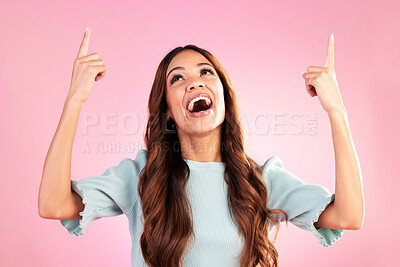 Buy stock photo Pointing, mockup and woman on pink background with happy, smile and excited for sale, deal or discount news. Advertising, hands and girl looking up for product placement, promotion and announcement