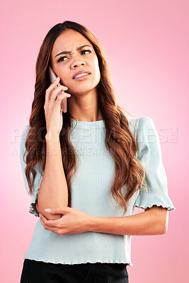 Buy stock photo Annoyed, phone call and angry with woman in studio for confused, communication and bad news. Problem, conflict and frustrated with female isolated on pink background for negative, upset and contact