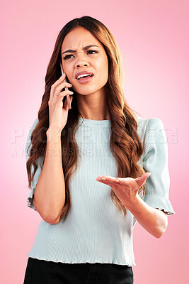 Buy stock photo Annoyed, phone call and confused with woman in studio for angry, communication and bad news. Problem, conflict and frustrated with female isolated on pink background for negative, upset and contact