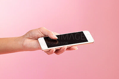 Buy stock photo Hands, phone mockup and screen in studio isolated on a pink background. Cellphone, social media and woman with mobile smartphone for branding, advertising or marketing for product placement space.