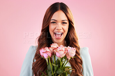 Buy stock photo Happy, smile and woman with roses in a studio for valentines day, romance or anniversary. Happiness, excited and portrait of a female model from Mexico with a bouquet of flowers by a pink background.