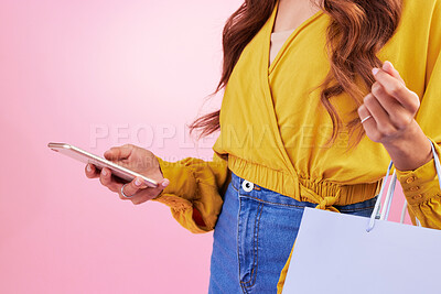Buy stock photo Phone, shopping bag and woman hands isolated on pink background for online shopping, ecommerce and retail. Fashion person on mobile app, cellphone or smartphone for discount, sale or promo in studio
