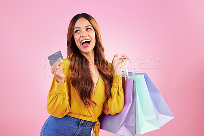 Buy stock photo Woman with shopping bag, retail and happy with credit card for payment and commerce on pink background. Customer, buy product at store or boutique, sale or promotion, female with smile in studio