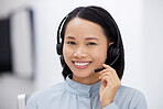 Asian woman, call center and smile in portrait, communication and CRM, headset with mic in office. Contact us, customer service or telemarketing, female consultant with smile and help desk