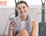 Gym, smile and relax, woman with phone and earphones on workout break reading messages or social media. Exercise, rest and person with smartphone for fitness app, music or networking for motivation.