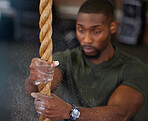 Fitness, rope and black man training, powder and exercise for endurance, balance and healthy lifestyle. Male athlete, guy and strength with workout, power and intense movement for energy and focus