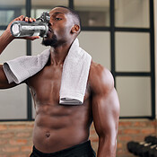 Premium Photo  Shirtless black man gym and water bottle for