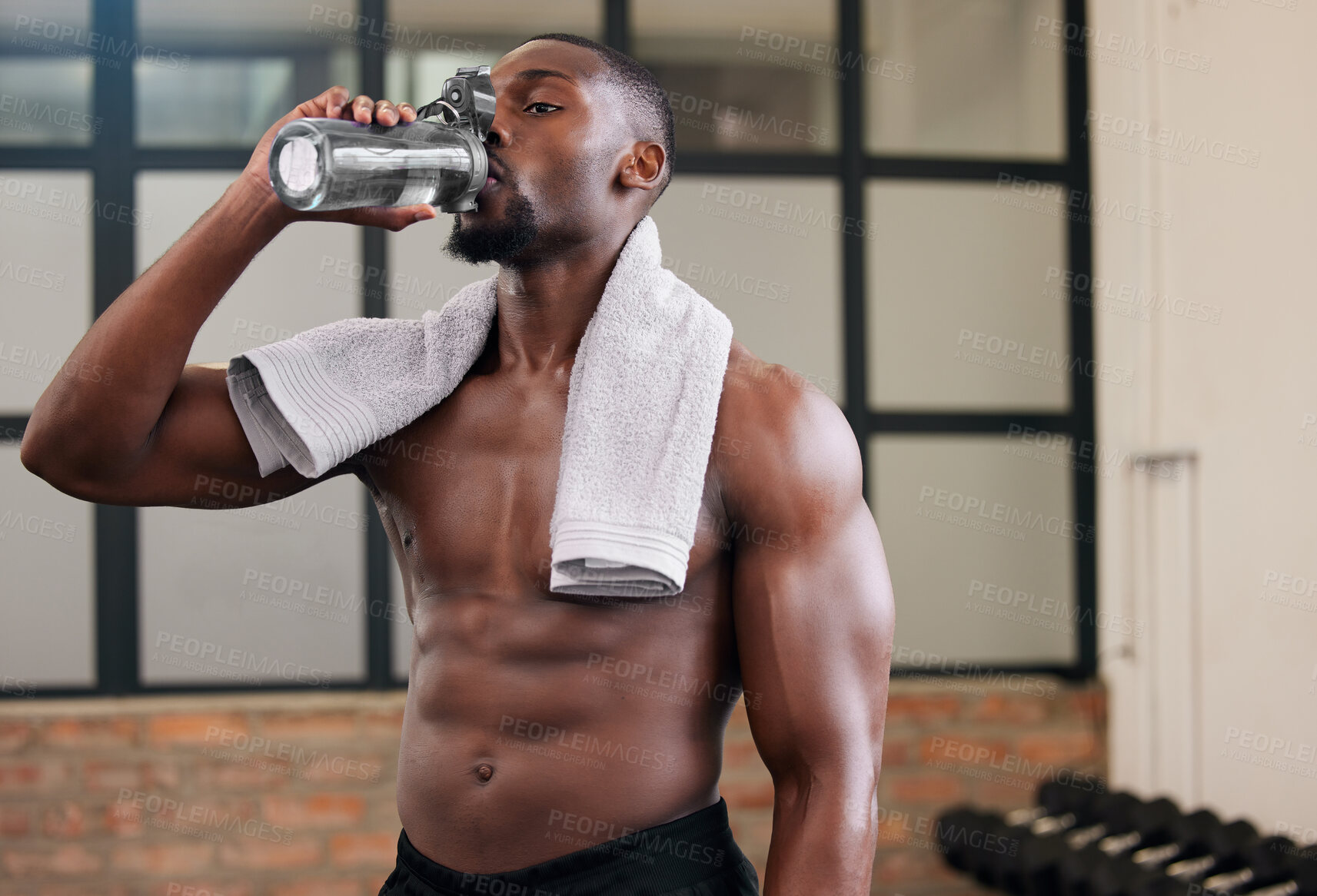 Buy stock photo Shirtless black man, gym and water bottle for health, break and energy of workout, training and exercise diet. Thirsty male, abs and drinking for fitness nutrition, body hydration and sports wellness